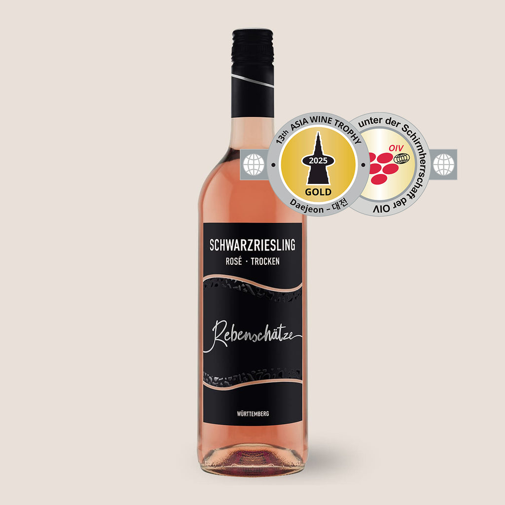 Flasche Rebenschätze Schwarzriesling Roséwein der WZG mit mehreren sichtbaren Wein-Auszeichnungen.